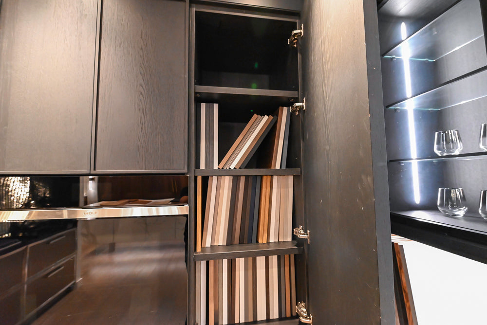 DOCA Modern Dark Brown Wood Veneer Kitchen Corner with White Ceasarstone Countertop & Integrated Sink