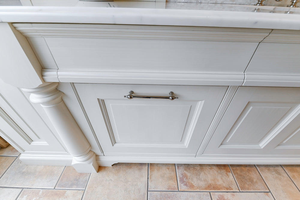Showcase Transitional White Kitchen with Marble Countertops and La Cornue Chateau 120 Range with French Top