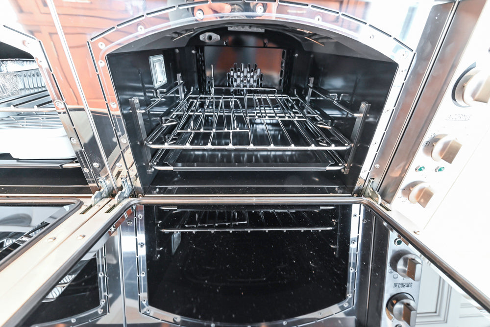 Showcase Transitional White Kitchen with Marble Countertops and La Cornue Chateau 120 Range with French Top