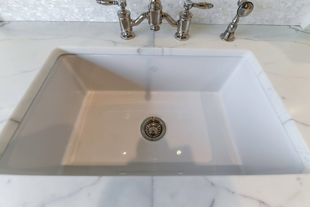 Showcase Transitional White Kitchen with Marble Countertops and La Cornue Chateau 120 Range with French Top