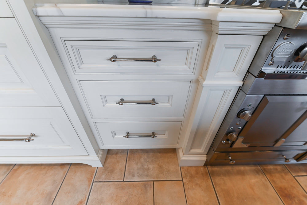 Showcase Transitional White Kitchen with Marble Countertops and La Cornue Chateau 120 Range with French Top