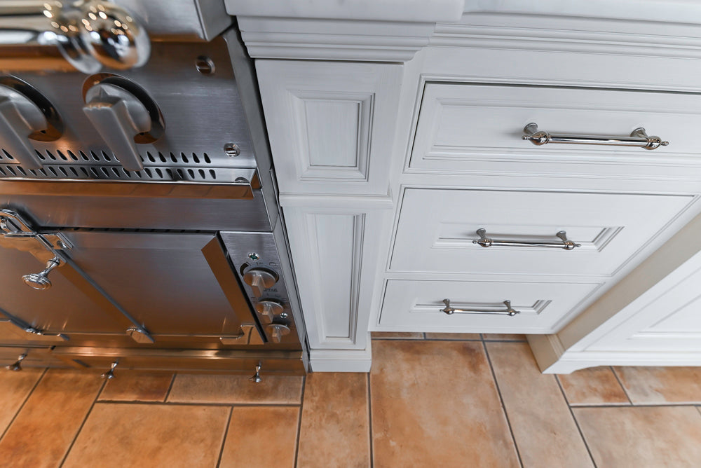 Showcase Transitional White Kitchen with Marble Countertops and La Cornue Chateau 120 Range with French Top
