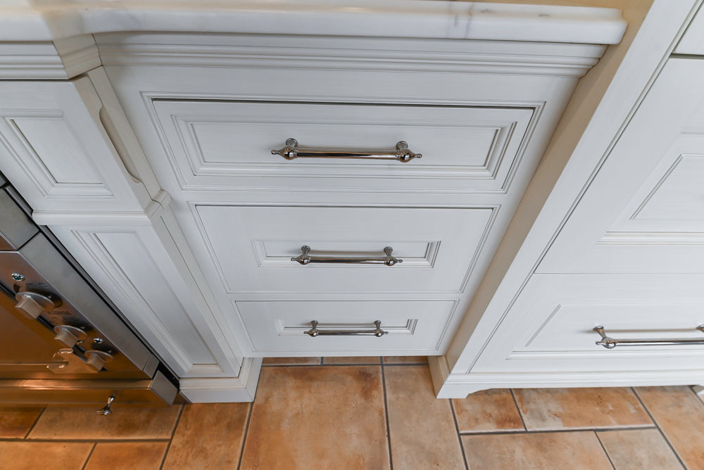 Showcase Transitional White Kitchen with Marble Countertops and La Cornue Chateau 120 Range with French Top