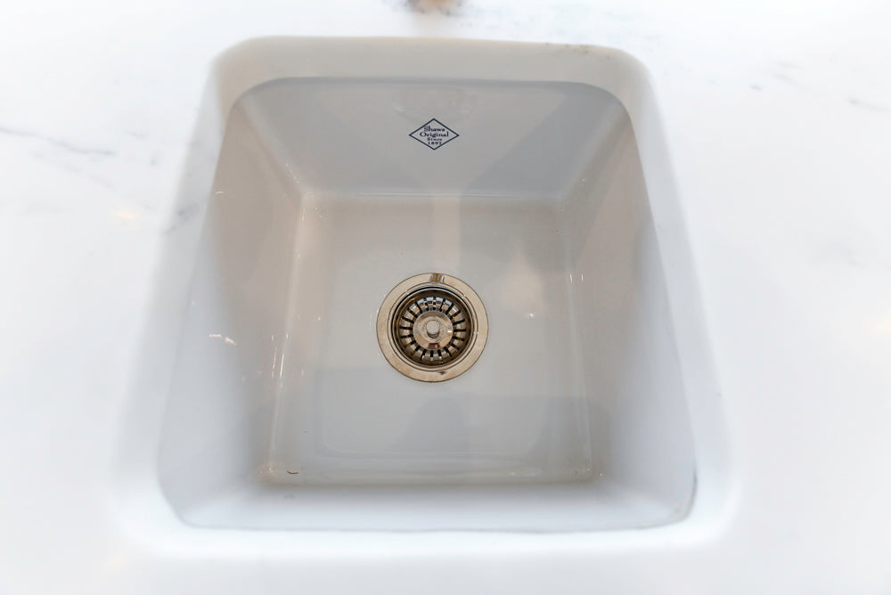 Showcase Transitional White Kitchen with Marble Countertops and La Cornue Chateau 120 Range with French Top