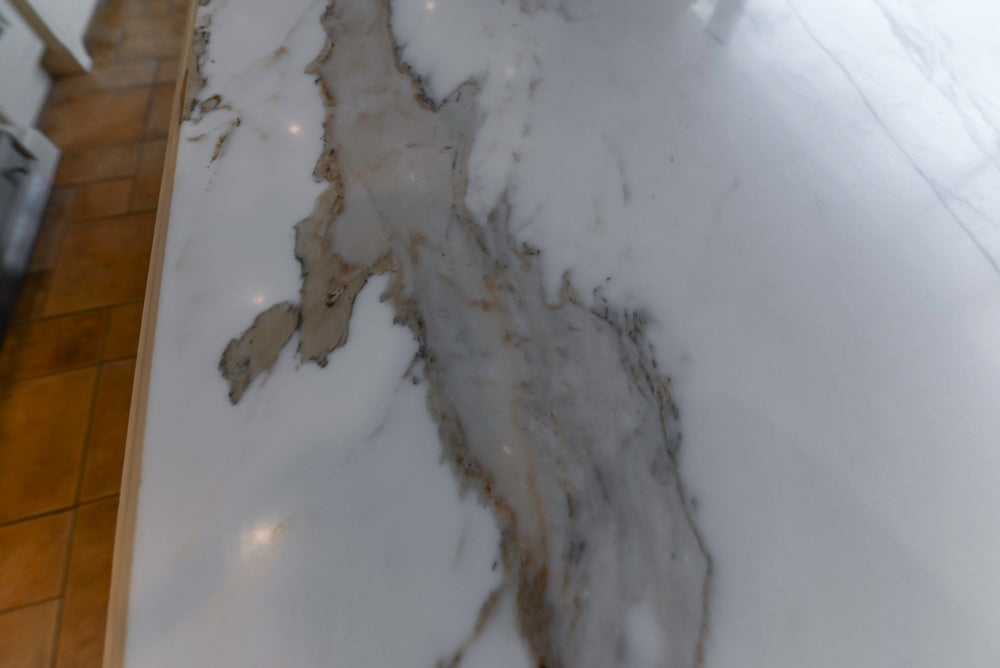 Showcase Transitional White Kitchen with Marble Countertops and La Cornue Chateau 120 Range with French Top