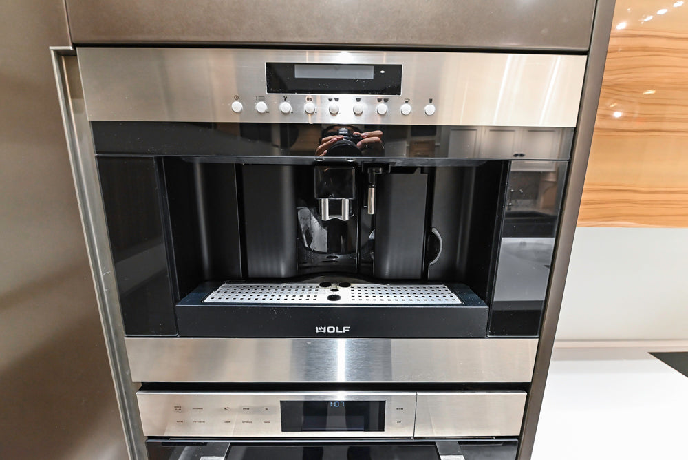 Composit Modern Brown Kitchen with Waterfall Island, Stone Countertops and Wolf & Sub-Zero Appliances