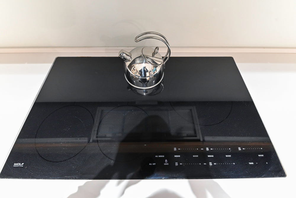 Composit Modern Brown Kitchen with Waterfall Island, Stone Countertops and Wolf & Sub-Zero Appliances