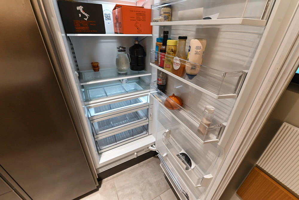 Composit Modern Brown Kitchen with Waterfall Island, Stone Countertops and Wolf & Sub-Zero Appliances