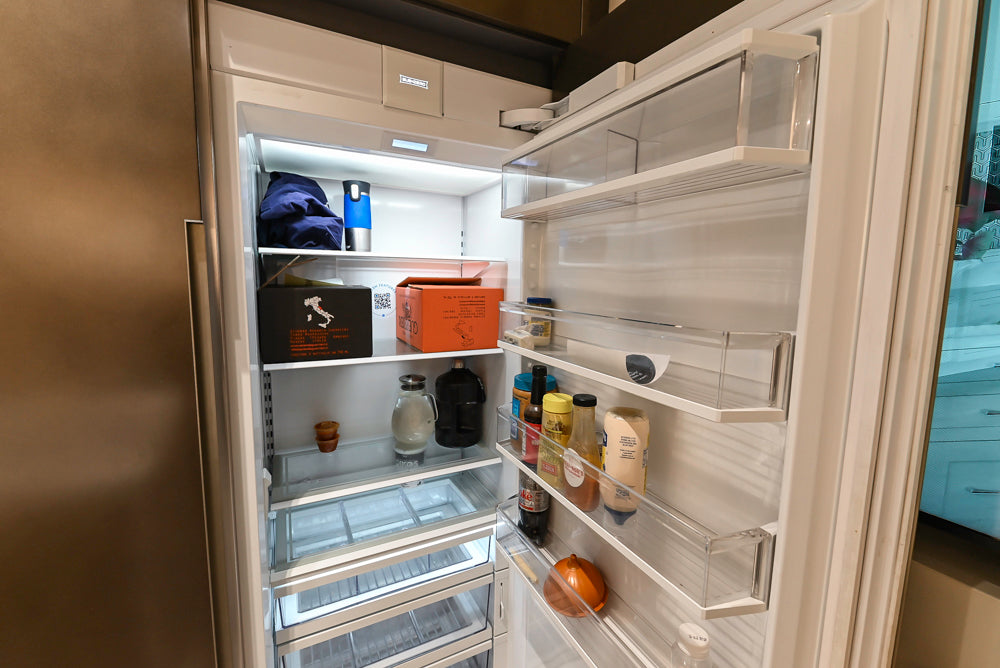 Composit Modern Brown Kitchen with Waterfall Island, Stone Countertops and Wolf & Sub-Zero Appliances