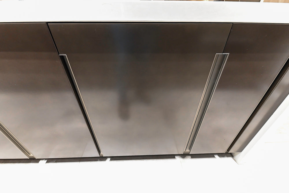 Composit Modern Brown Kitchen with Waterfall Island, Stone Countertops and Wolf & Sub-Zero Appliances