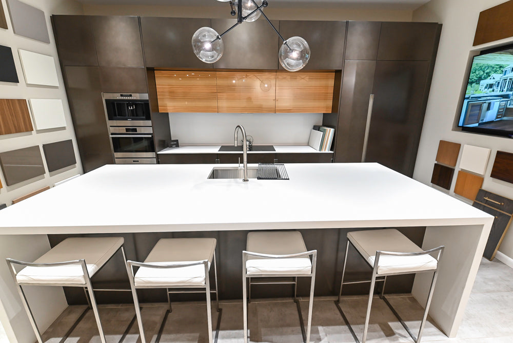 Composit Modern Brown Kitchen with Waterfall Island, Stone Countertops and Wolf & Sub-Zero Appliances