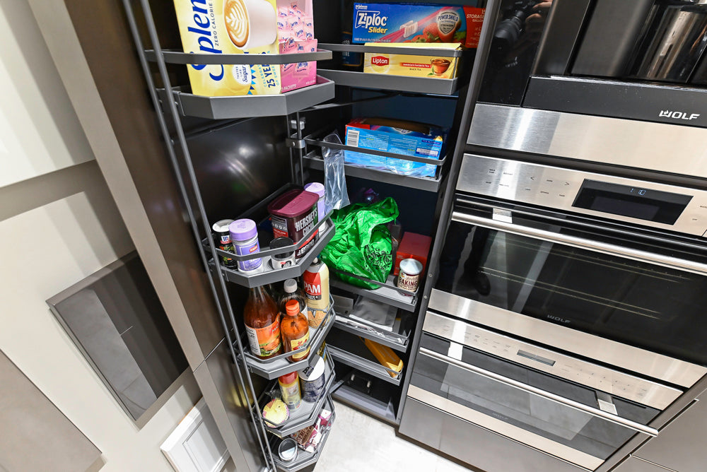 Composit Modern Brown Kitchen with Waterfall Island, Stone Countertops and Wolf & Sub-Zero Appliances