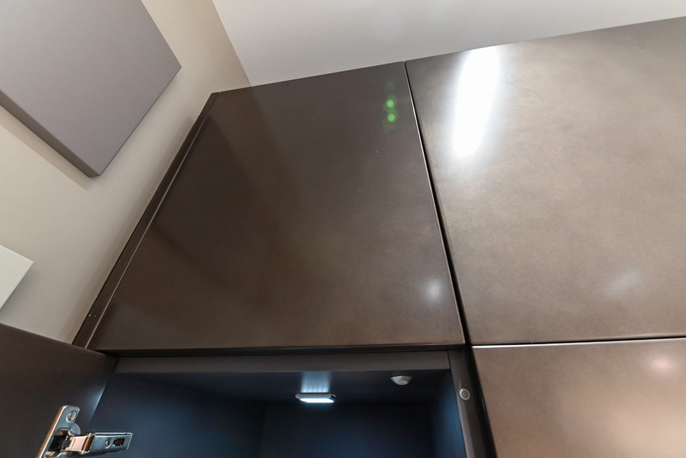 Composit Modern Brown Kitchen with Waterfall Island, Stone Countertops and Wolf & Sub-Zero Appliances