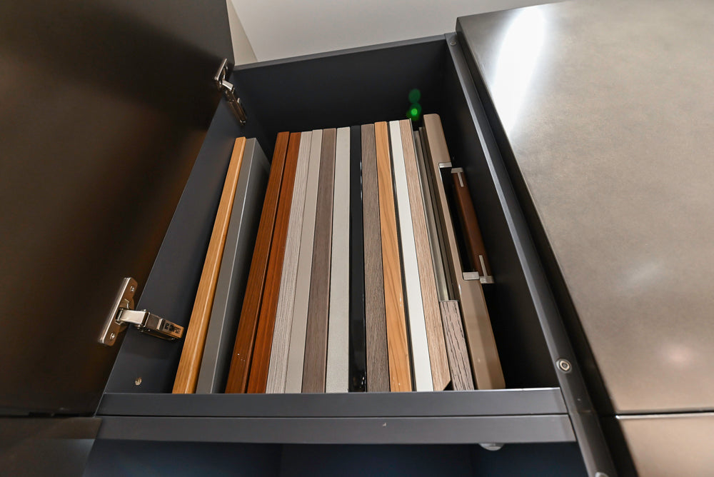 Composit Modern Brown Kitchen with Waterfall Island, Stone Countertops and Wolf & Sub-Zero Appliances