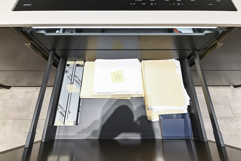 Composit Modern Brown Kitchen with Waterfall Island, Stone Countertops and Wolf & Sub-Zero Appliances