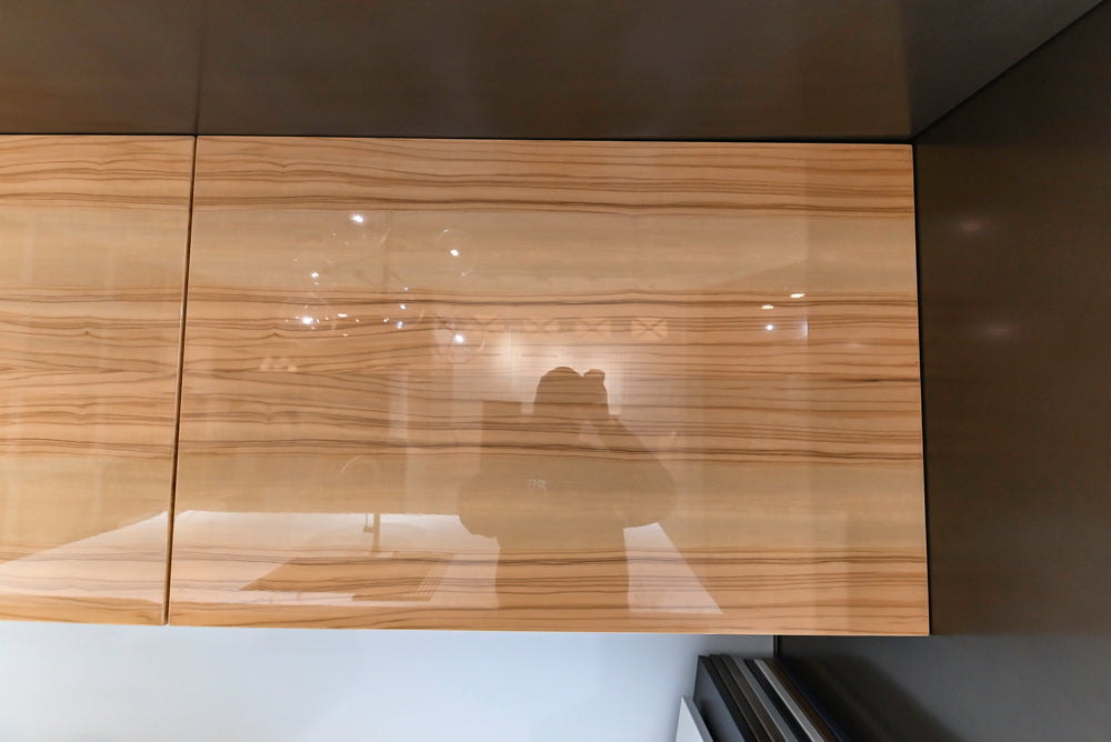 Composit Modern Brown Kitchen with Waterfall Island, Stone Countertops and Wolf & Sub-Zero Appliances