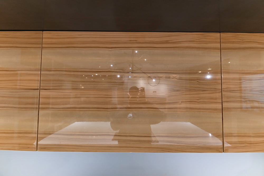 Composit Modern Brown Kitchen with Waterfall Island, Stone Countertops and Wolf & Sub-Zero Appliances