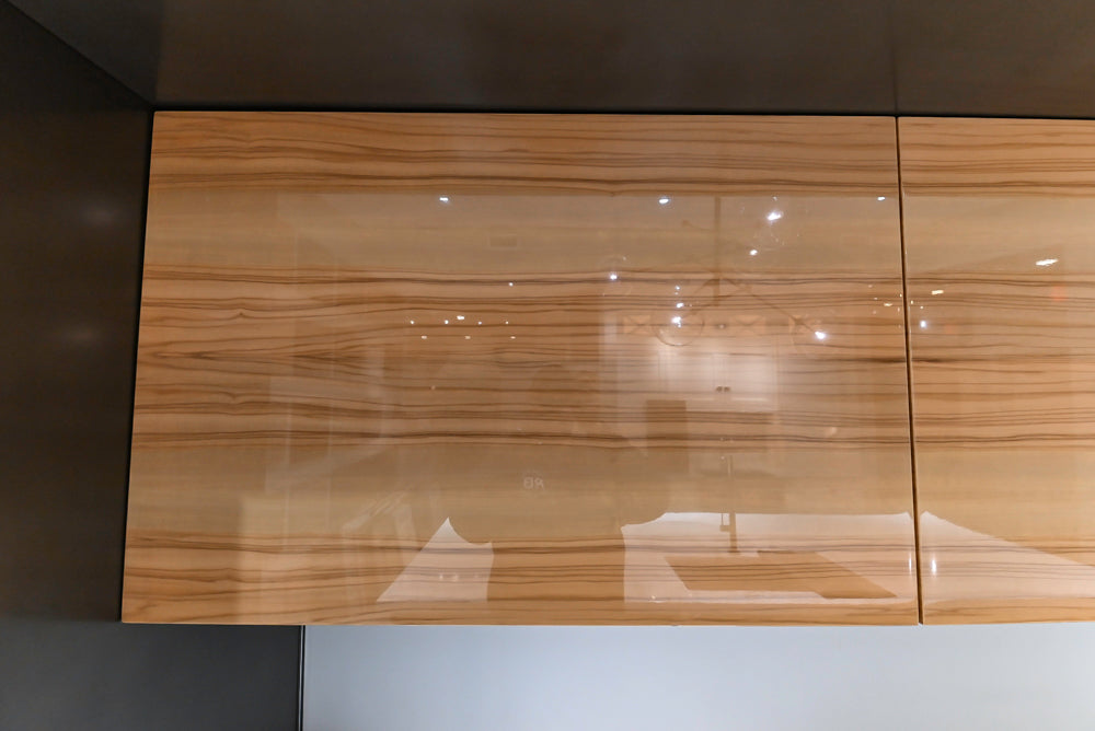 Composit Modern Brown Kitchen with Waterfall Island, Stone Countertops and Wolf & Sub-Zero Appliances