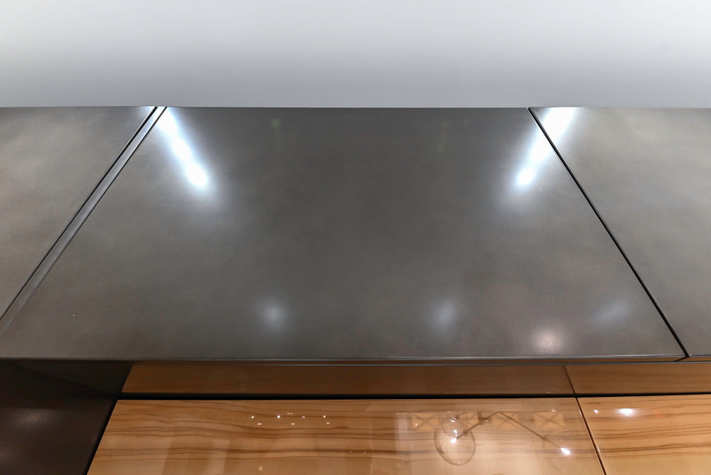 Composit Modern Brown Kitchen with Waterfall Island, Stone Countertops and Wolf & Sub-Zero Appliances