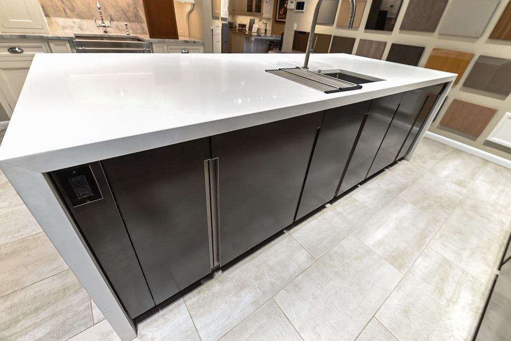 Composit Modern Brown Kitchen with Waterfall Island, Stone Countertops and Wolf & Sub-Zero Appliances