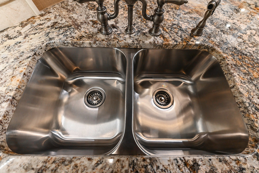 Signature Custom Traditional White Kitchen with Granite Countertops and Appliances