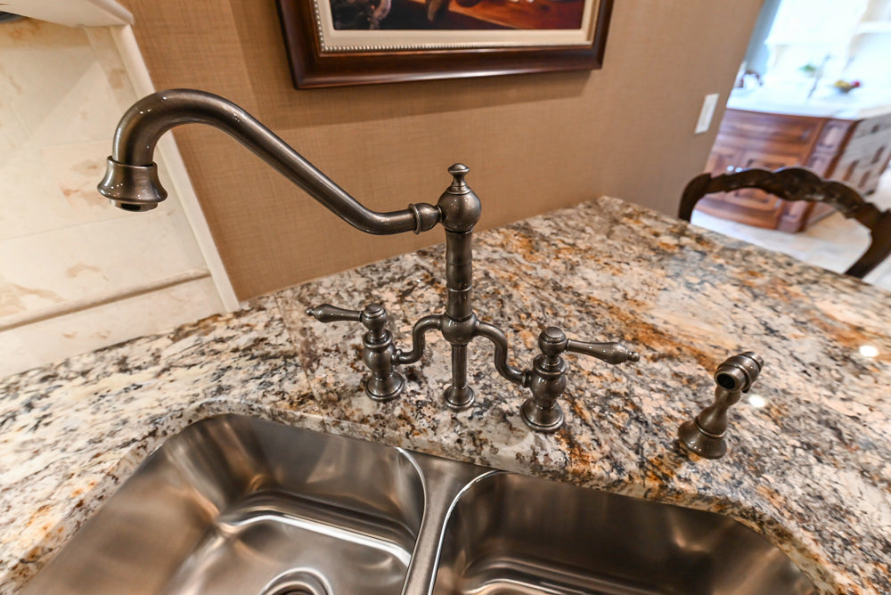 Signature Custom Traditional White Kitchen with Granite Countertops and Appliances