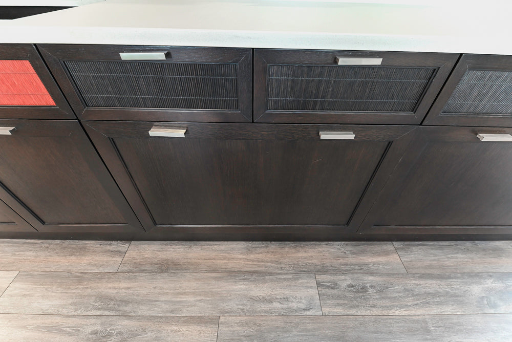 handcrafted Bamax solid oak kitchen cabinetry wall with crimson red bamboo faces in a luxury estate