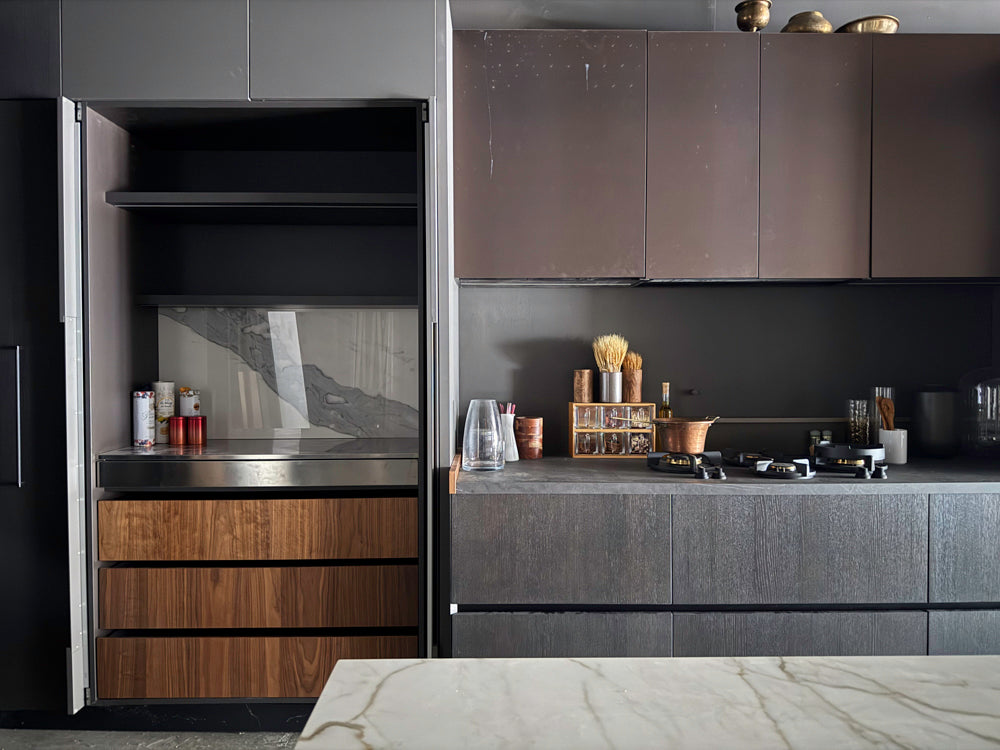 Luxury kitchen island with sliding wood veneer top and stone countertop
