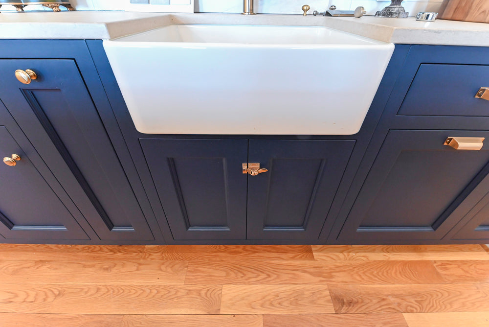 Quality Custom Navy Blue Partial Kitchen with Matching Island and White Farmhouse Sink
