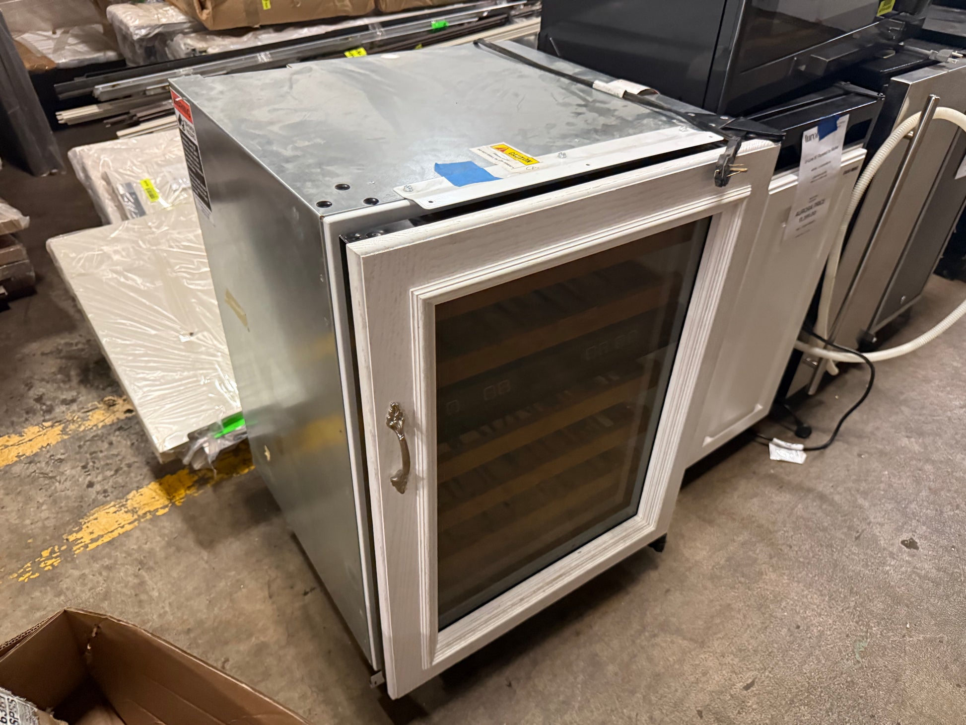 Sub Zero 424G glass door wine refrigerator showing dual zone digital controls inside cabinet