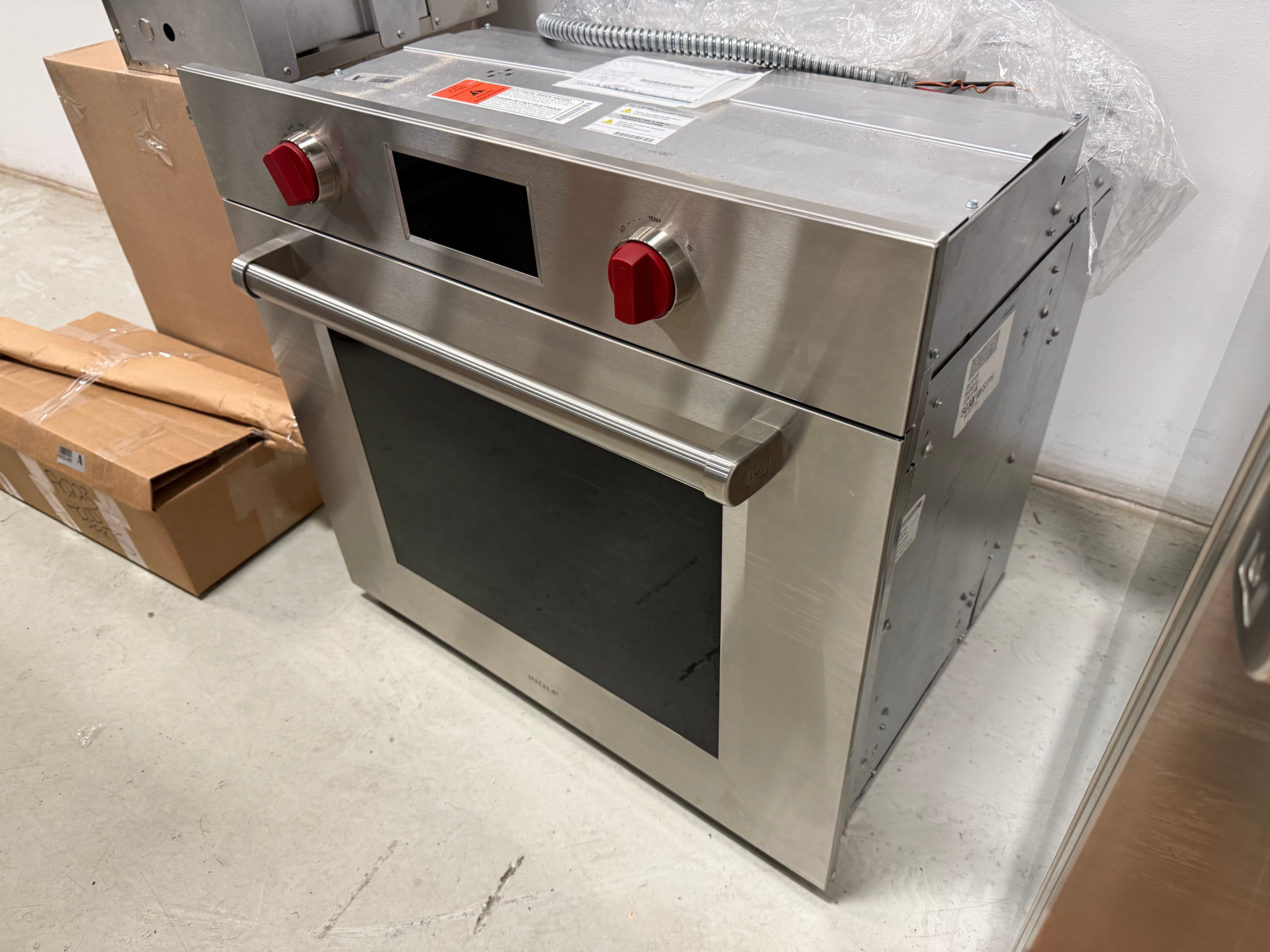 Luxury 30 inch built-in electric wall oven with professional tubular handle by Wolf