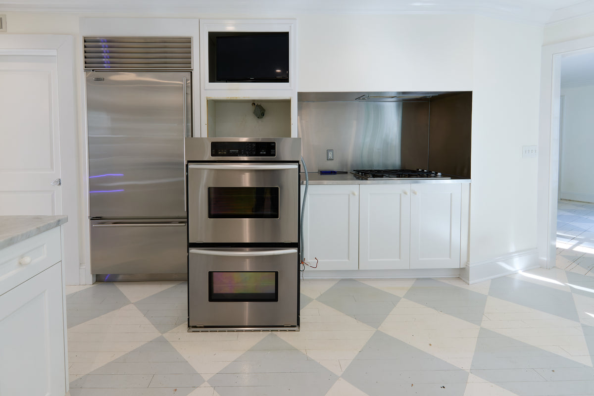 High-end architectural contemporary white kitchen storage wall and island base