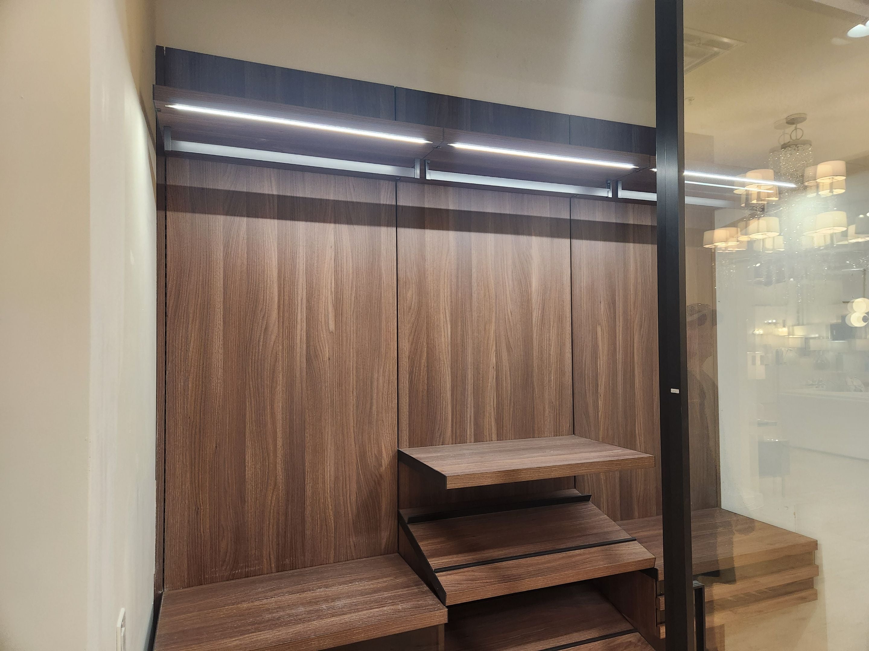 Luxury European custom walk-in closet with brown laminate finish