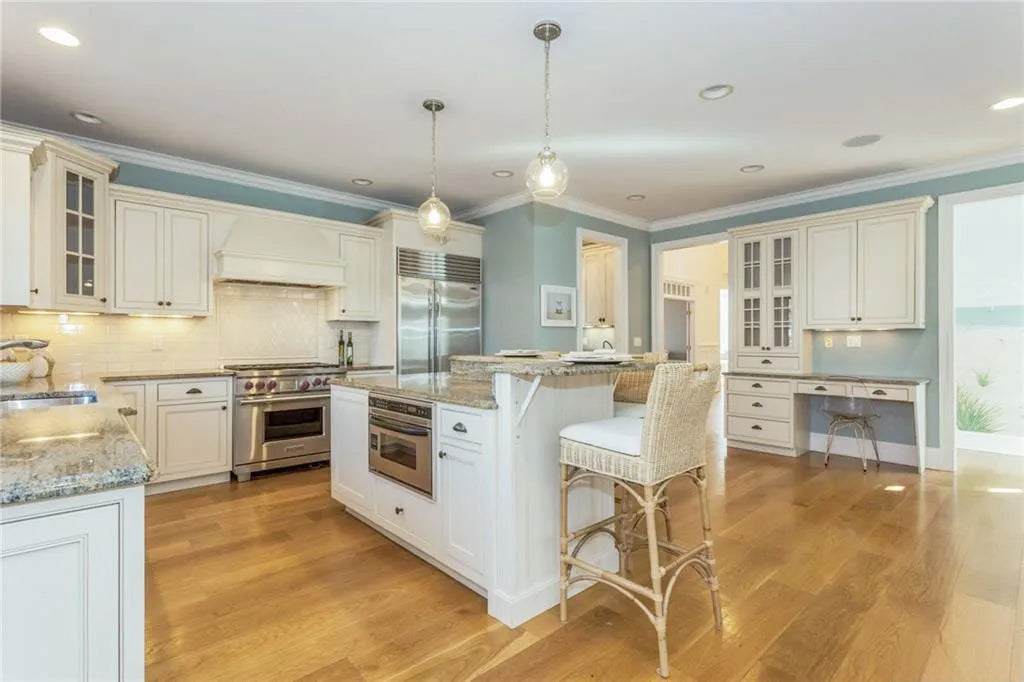 Omega Traditional Light Cream Kitchen with Island, Desk Area and Sub-Zero & Wolf Range