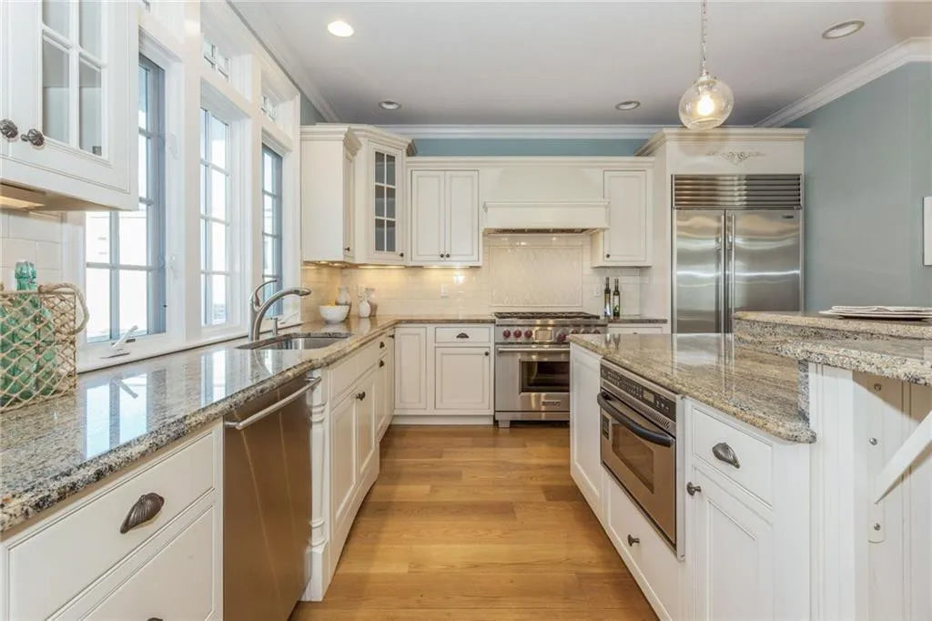 Omega Traditional Light Cream Kitchen with Island, Desk Area and Sub-Zero & Wolf Range