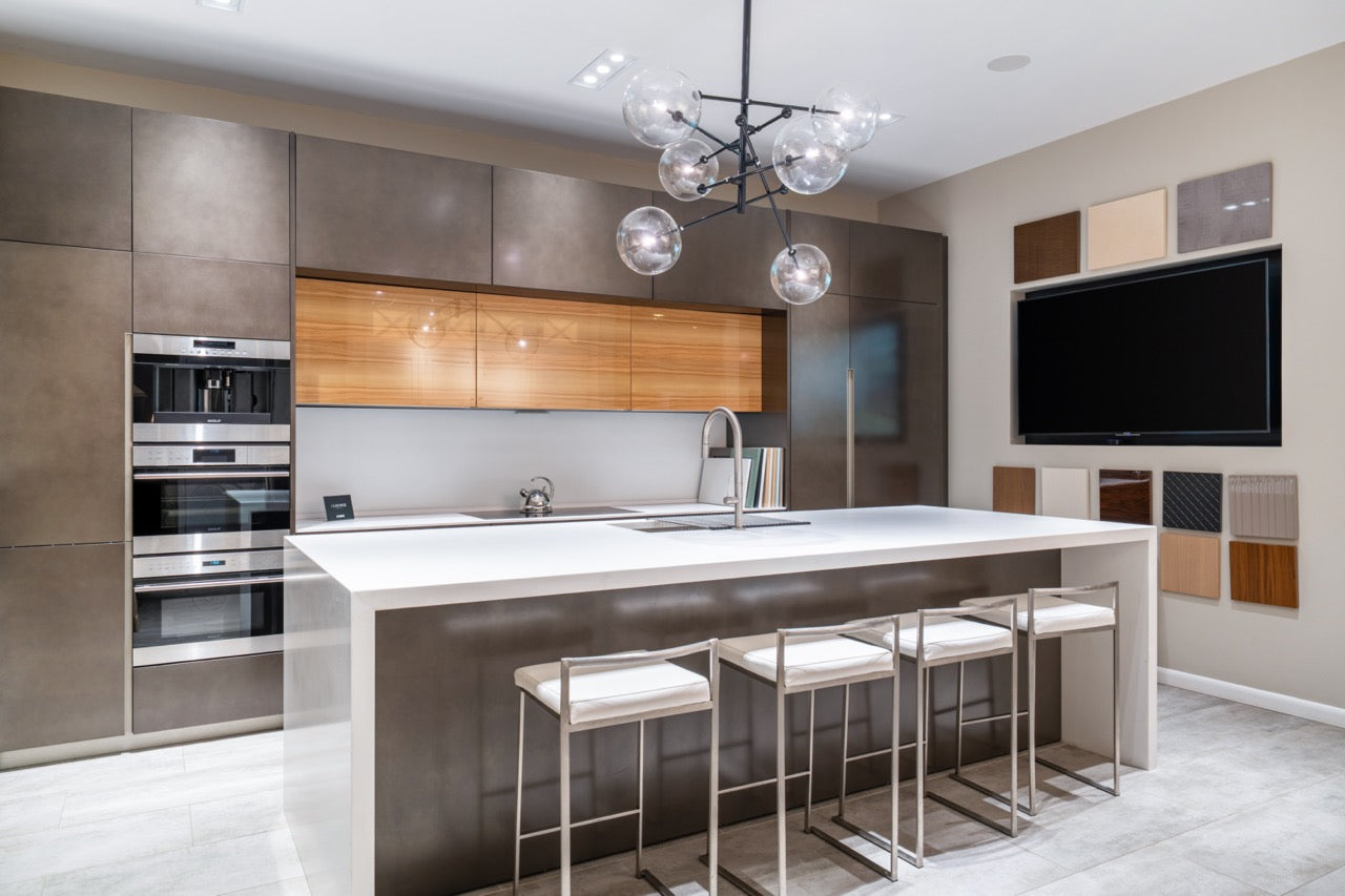 Composit Modern Brown Kitchen with Waterfall Island, Stone Countertops and Wolf & Sub-Zero Appliances