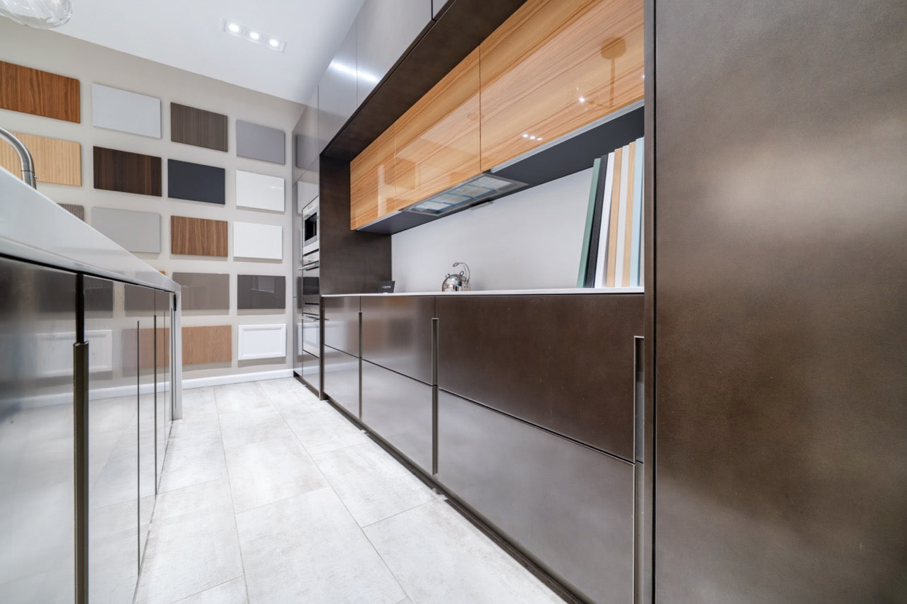 Composit Modern Brown Kitchen with Waterfall Island, Stone Countertops and Wolf & Sub-Zero Appliances