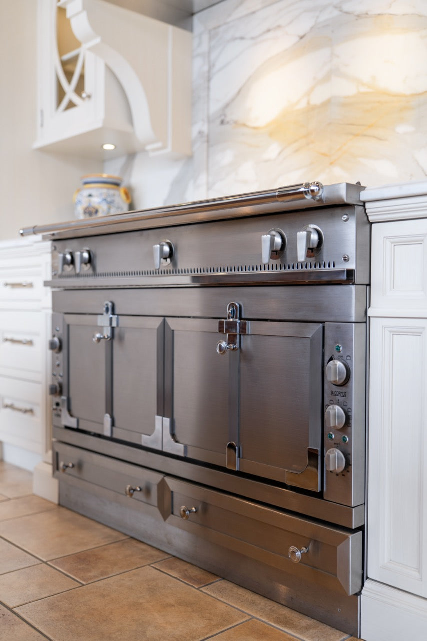 Showcase Transitional White Kitchen with Marble Countertops and La Cornue Chateau 120 Range with French Top