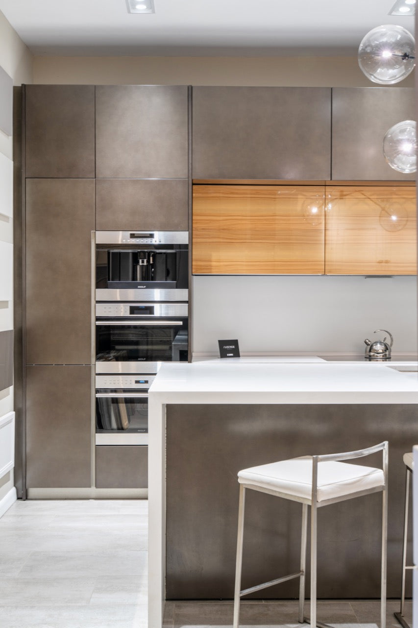 Composit Modern Brown Kitchen with Waterfall Island, Stone Countertops and Wolf & Sub-Zero Appliances
