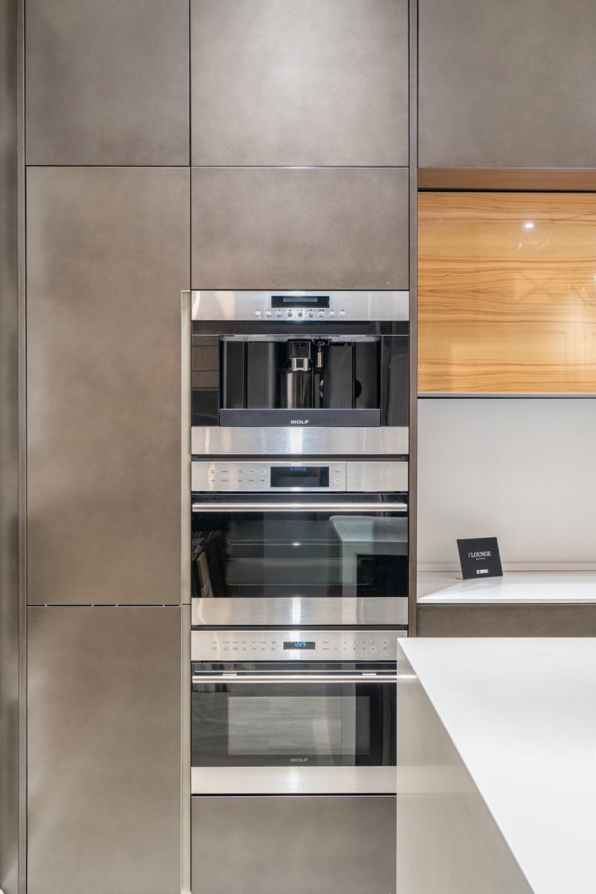 Composit Modern Brown Kitchen with Waterfall Island, Stone Countertops and Wolf & Sub-Zero Appliances
