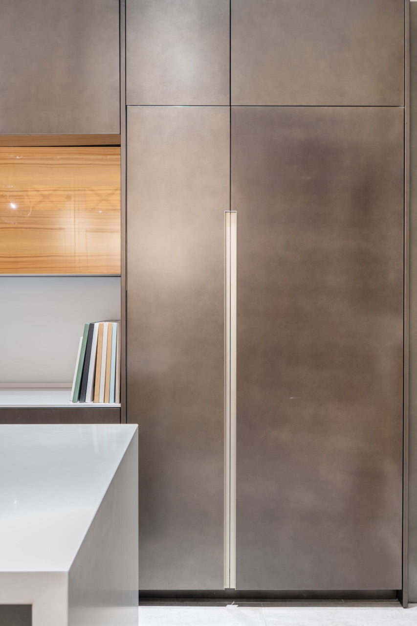 Composit Modern Brown Kitchen with Waterfall Island, Stone Countertops and Wolf & Sub-Zero Appliances