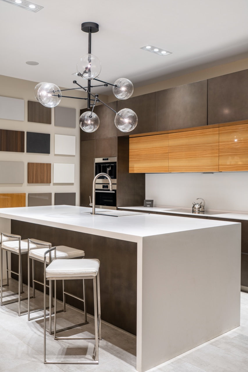 Composit Modern Brown Kitchen with Waterfall Island, Stone Countertops and Wolf & Sub-Zero Appliances