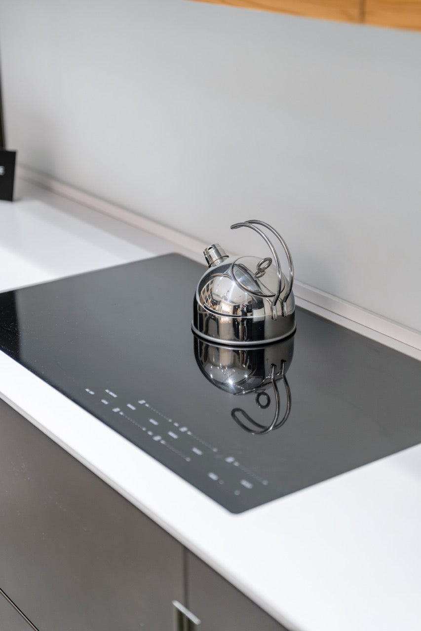 Composit Modern Brown Kitchen with Waterfall Island, Stone Countertops and Wolf & Sub-Zero Appliances