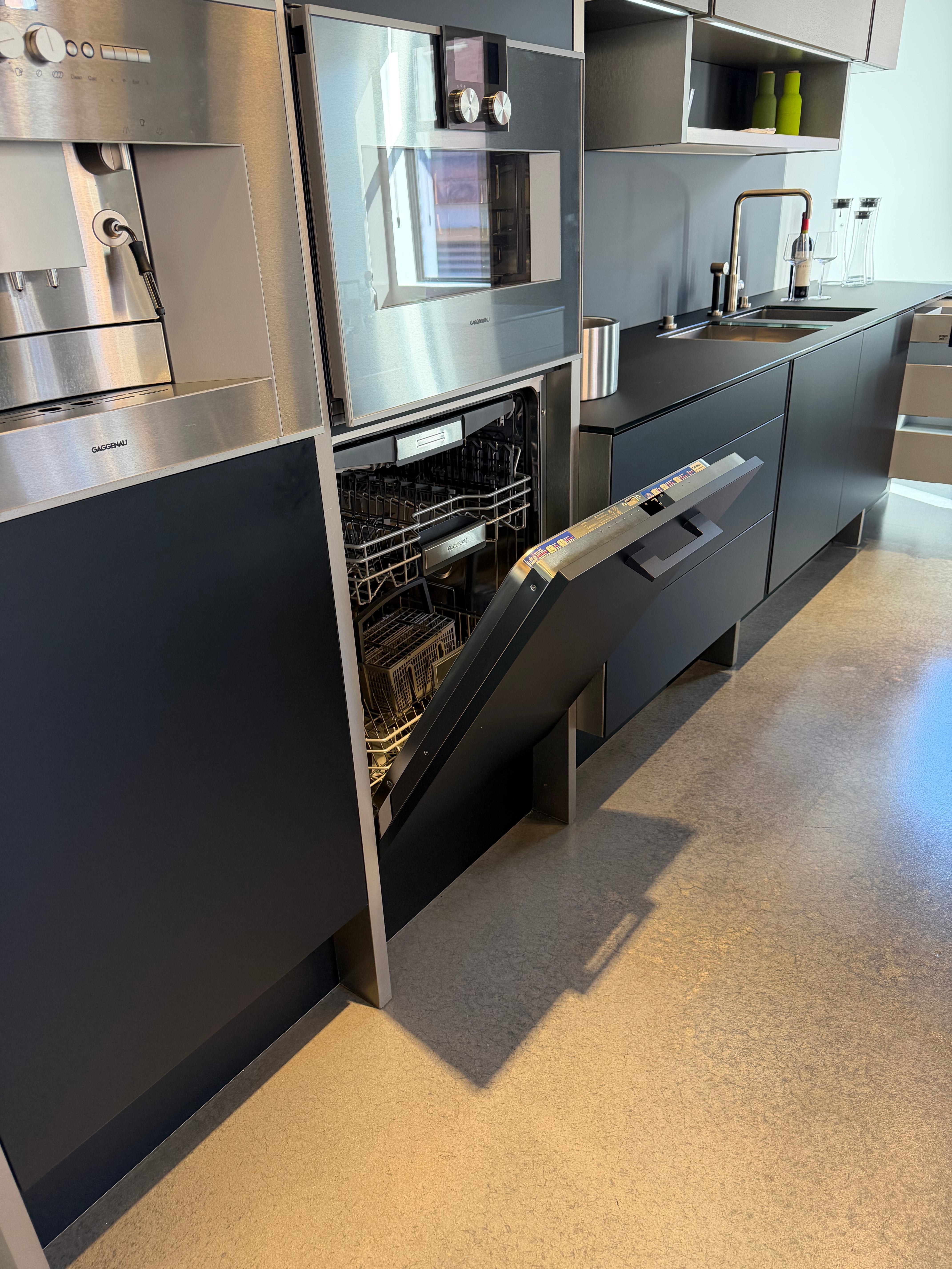 Poggenpohl Porsche Modern Matte Grey Kitchen with Wood Top Seating Area and Gaggenau Appliances