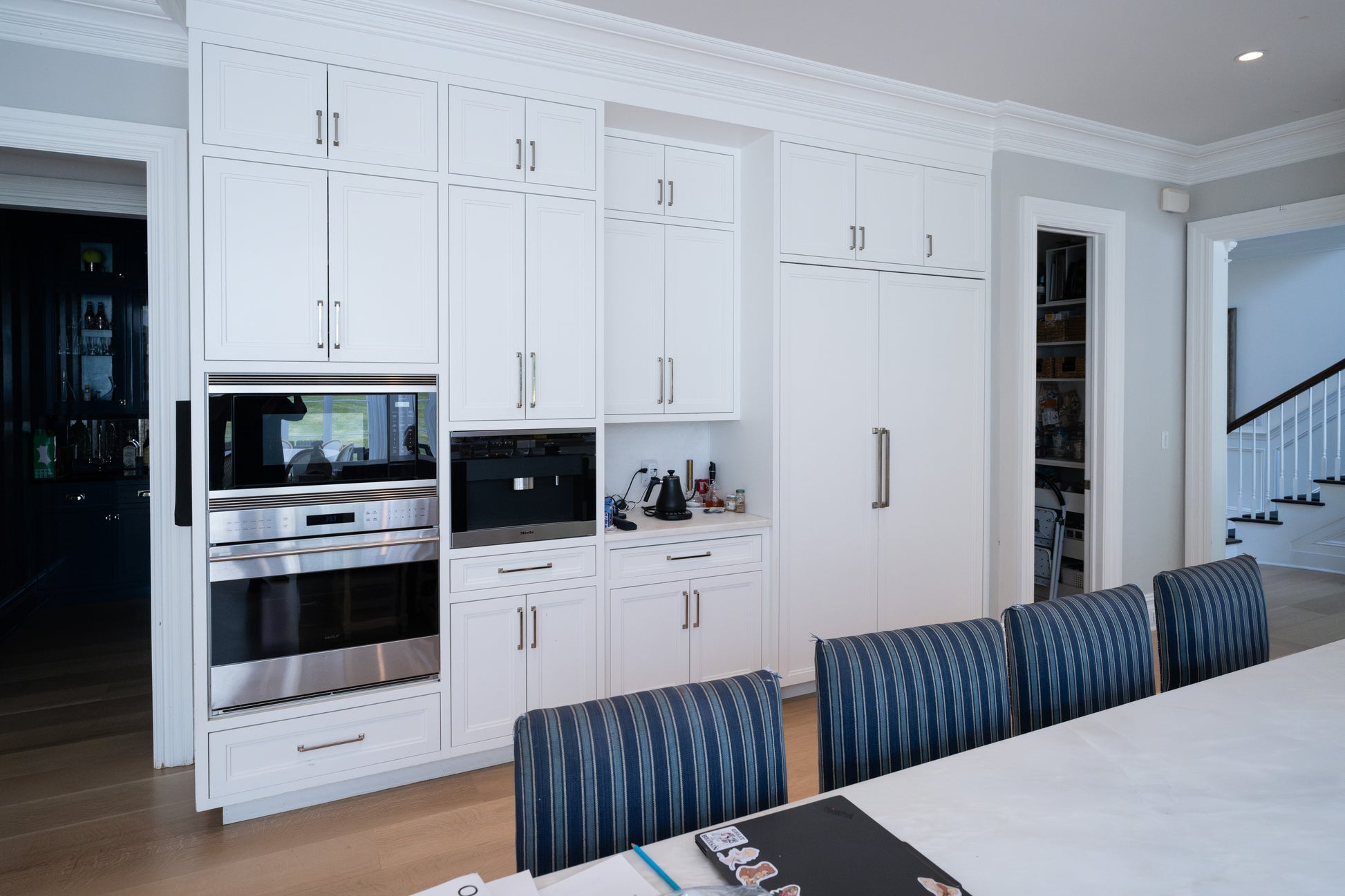 Premium factory painted white paneled cabinet drawers showing solid wood dovetail construction
