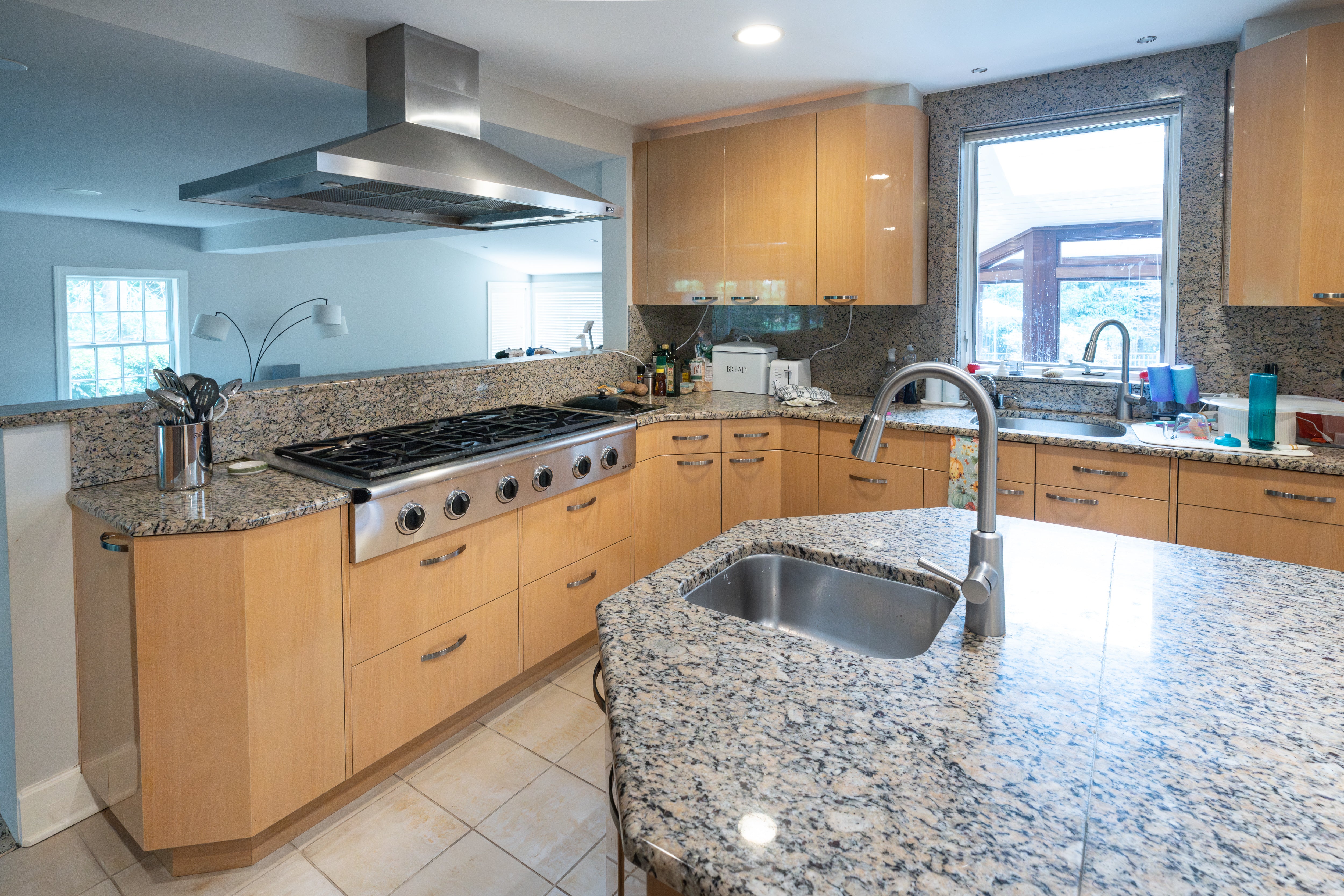 The Copenhagen modern light oak kitchen with island and 48 inch Sub-Zero refrigerator