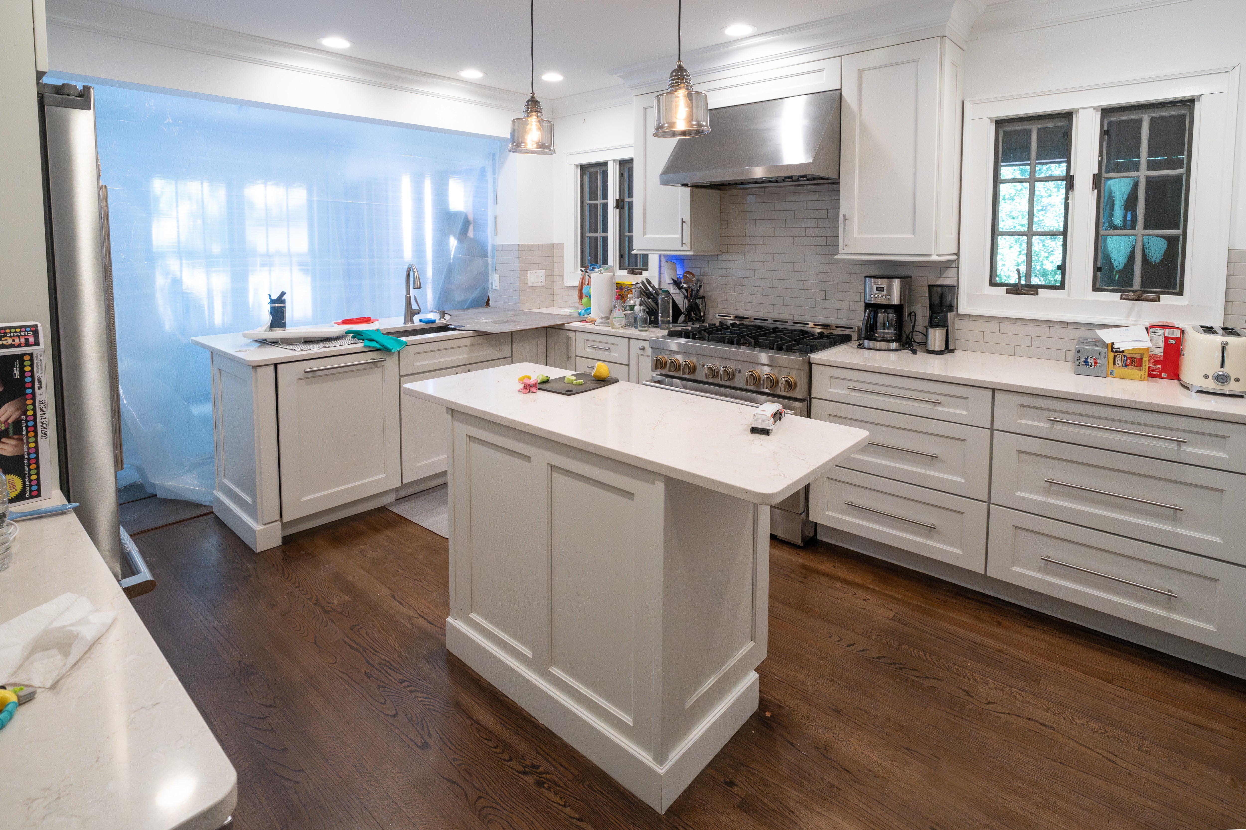 Wellborn transitional white custom kitchen set with integrated JennAir appliances