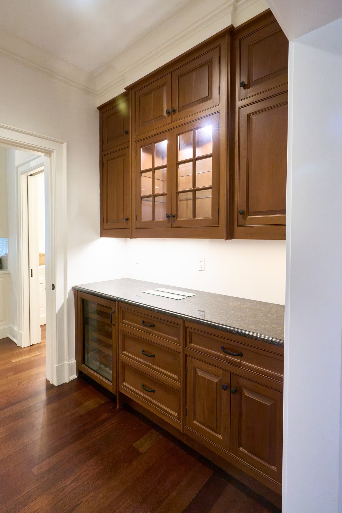The Sovereign transitional natural wood butler's pantry with Sub-Zero appliances