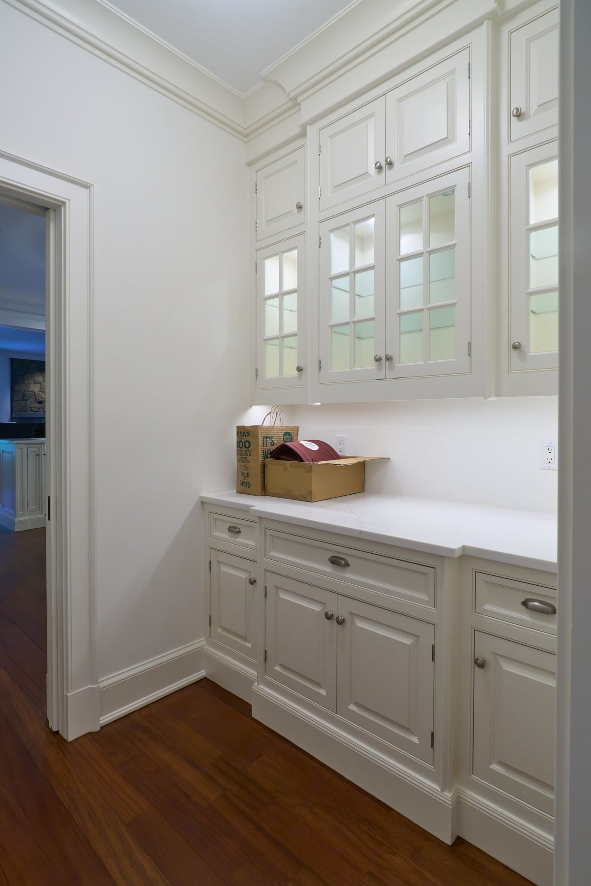 The Sovereign transitional snow white pantry wall custom kitchen cabinetry