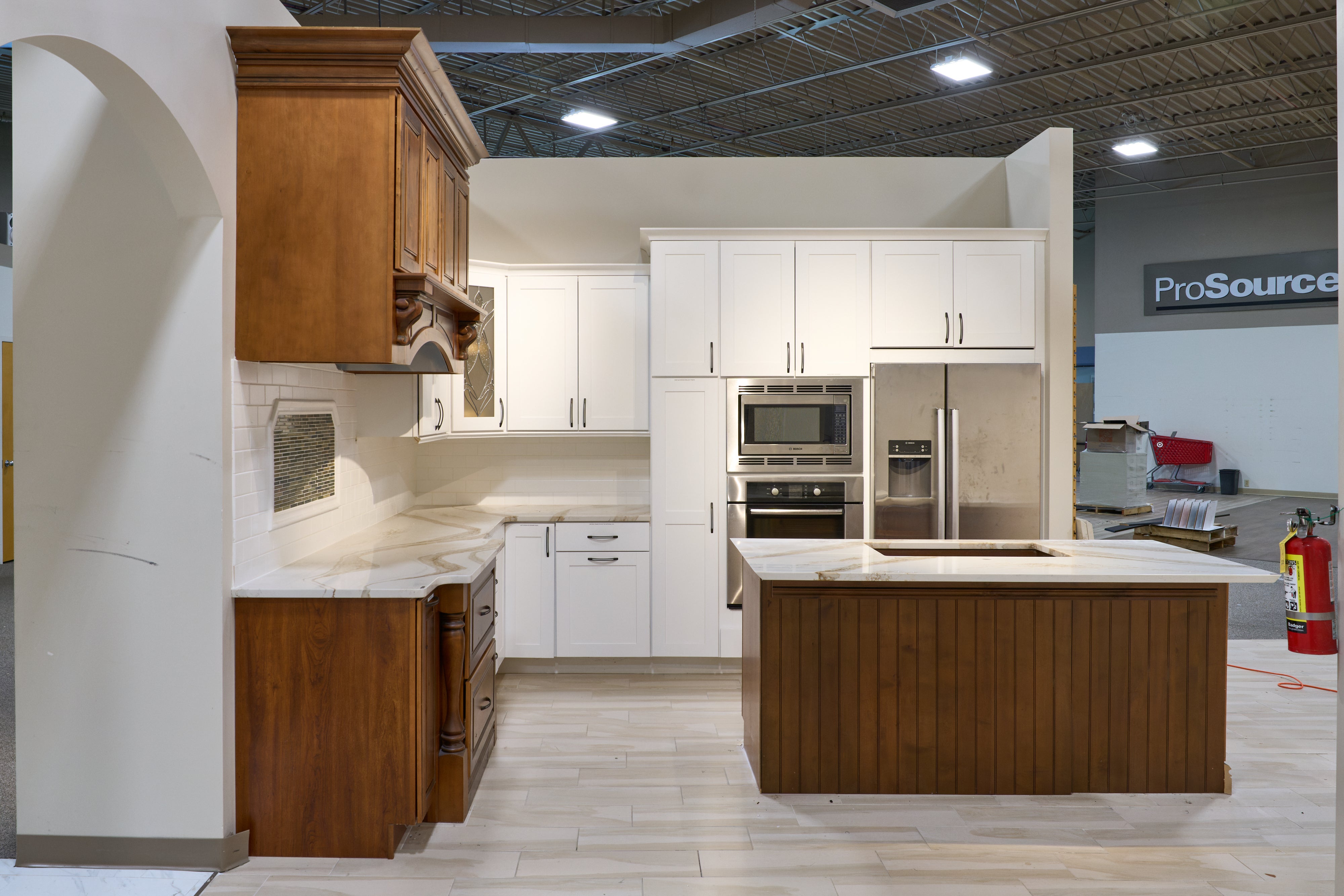 Complete luxury showroom display white kitchen cabinetry with center island